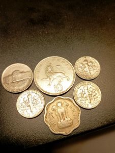 5 Foreign And 1 Indian coins.