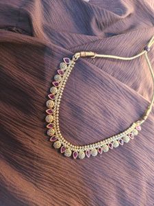 Elegant Gold-Tone Necklace with Red Accents