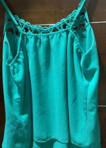 It Is A Teal Green Coloured Top Of Free Size.