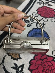 silver fancy hand bag all metal