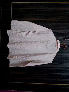 Pink chiffon shirt.