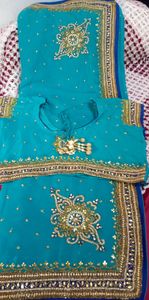party wear saree firozi colour saree &amp; dark blue border with beautifu work as per showing in pic full length saree blouse size mention in pic