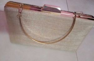 get this  embroidered branded cluch @499