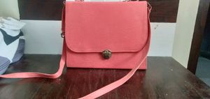 Combo for asma. Pink sling sturdy bag. used a few times. slight stains on the inside. working zips and in good condition