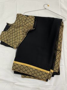 Pretty Black Saree With Golden Border..