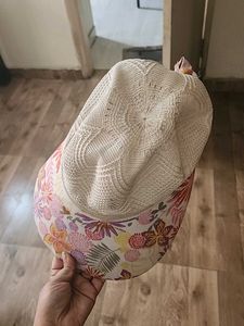 Sun Protection Cap And Black Ceramic Flower Vase