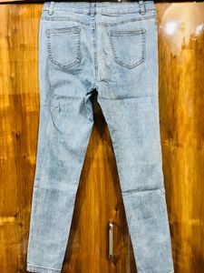 Ripped Knee Light Wash Jeans