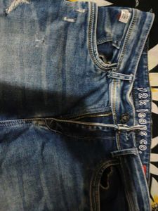 Distressed Blue Denim Jeans