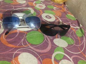 Both Sunglasses At Very Good Condition.