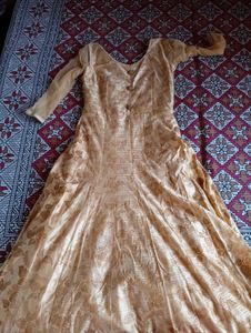 Nude Floral Gown With Cancan Styled Wit Stone Work