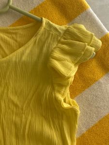 yellow color top with cute flowy hand frill