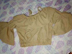 Ruffled embellished tan blouse