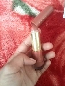 Hilary Rhoda Lipstick and a art piece