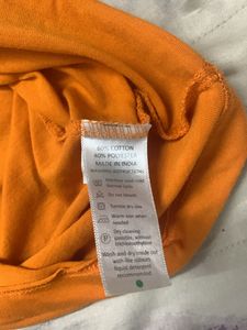 Orange Cold Shoulder Top From Myntra