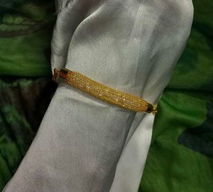 Golden Bracelet with Shimmering Diamond Accents