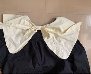 Avant-Garde Black Dress with White Collar
