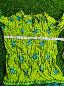 Flourescent green 💚 tunic with blue origami birds