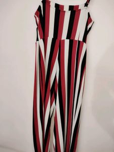 fitted bodice and down to elongated flared Pants