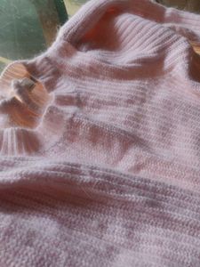 light pink sweater for cozy winters.