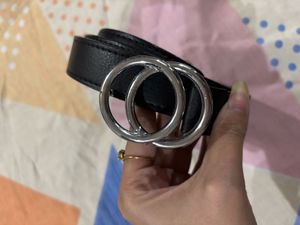 A black belt with silver buckle