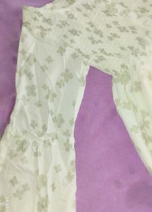 A Ruffled , Smoking Top With Good Sleeves