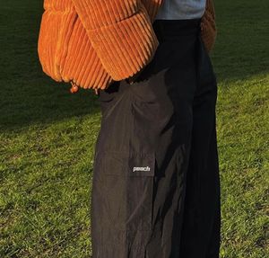 Peach Baggy Black Wide Leg Cargo Pants.