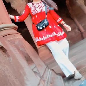 A beautiful red chikankari short kurti