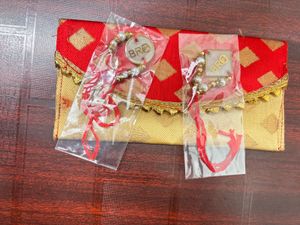 Pack Of 2 Resin Rakhi With A Money Holder