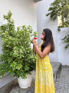 backless yellow flowy sundress