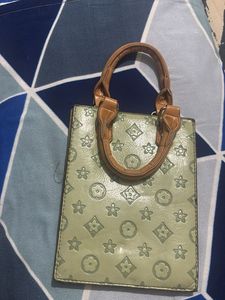 Louie’s Vitton patterned mini handbag