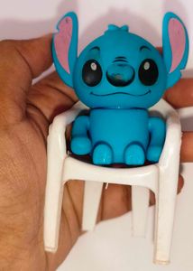 Stitch Figurine and white chair