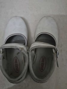 Used white school shoes