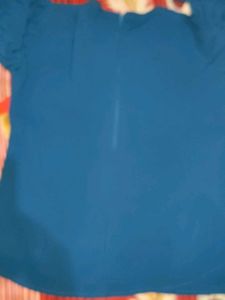 Elegant Blue Top with Detailed Sleeves