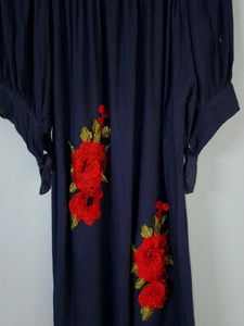 A Beautiful Western Dress With Red Roses