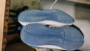 Used Blue Running Shoes