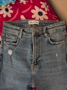 Distressed Light Wash Denim Jeans