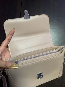 Nude Sling Bag With Silver