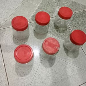6 small size glass containers.