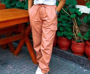 a pink cargo style joggers.