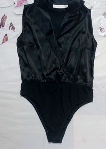 blacksatinbodysuit with a collared, wrap-style Top