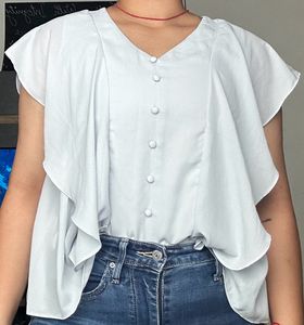 light blue frilled top