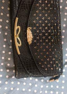 Black Clutch with Gold Accents