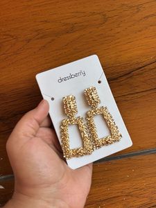 Gold toned textured geometric drop earrings