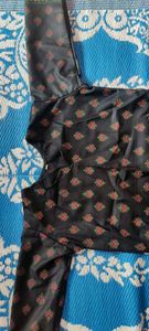 pure cotton black colour long kurta which has red and green printed flowers ..the kurta is unused