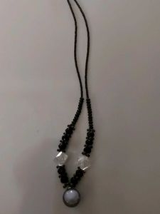 The necklace in th