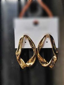 Fashionable Silver and golden Tone Dangle Earrings