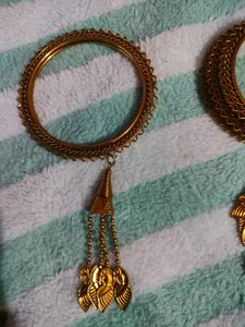 Elegant Gold-Tone Bangles with Dangling Charms