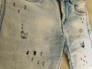 Distressed Light Wash Denim Jeans