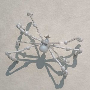 WHITE BEADED SPIDER CHARM