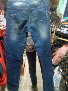 Distressed Blue Denim Jeans